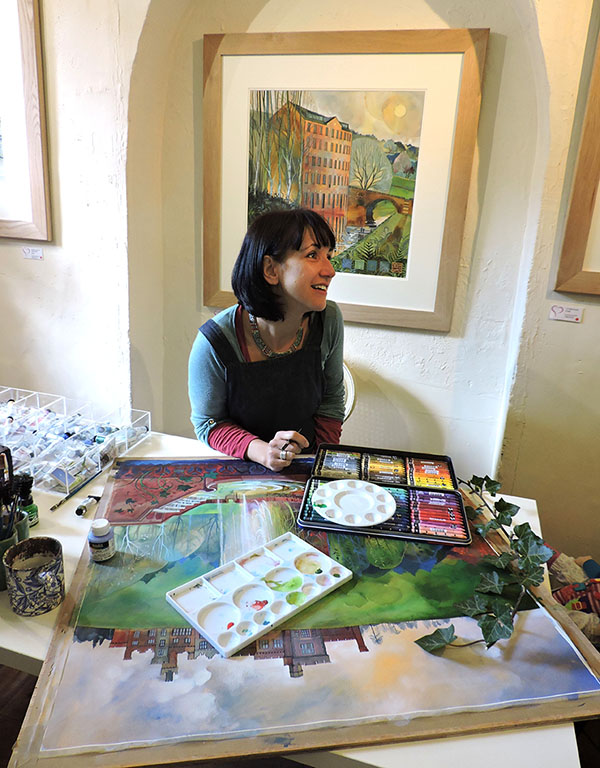 The artist Kate Lycett working on a painting